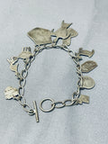 Detailed Important Vintage Native American Navajo Charm Sterling Silver Bracelet-Nativo Arts